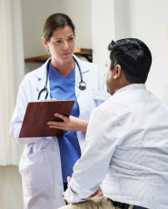 Physician talking to patient about allergy testing and treatment insurance